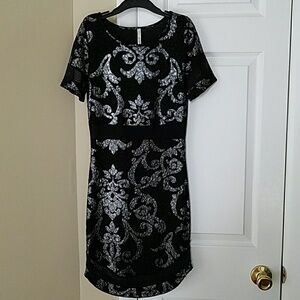 Very sleek black and silver party dress.